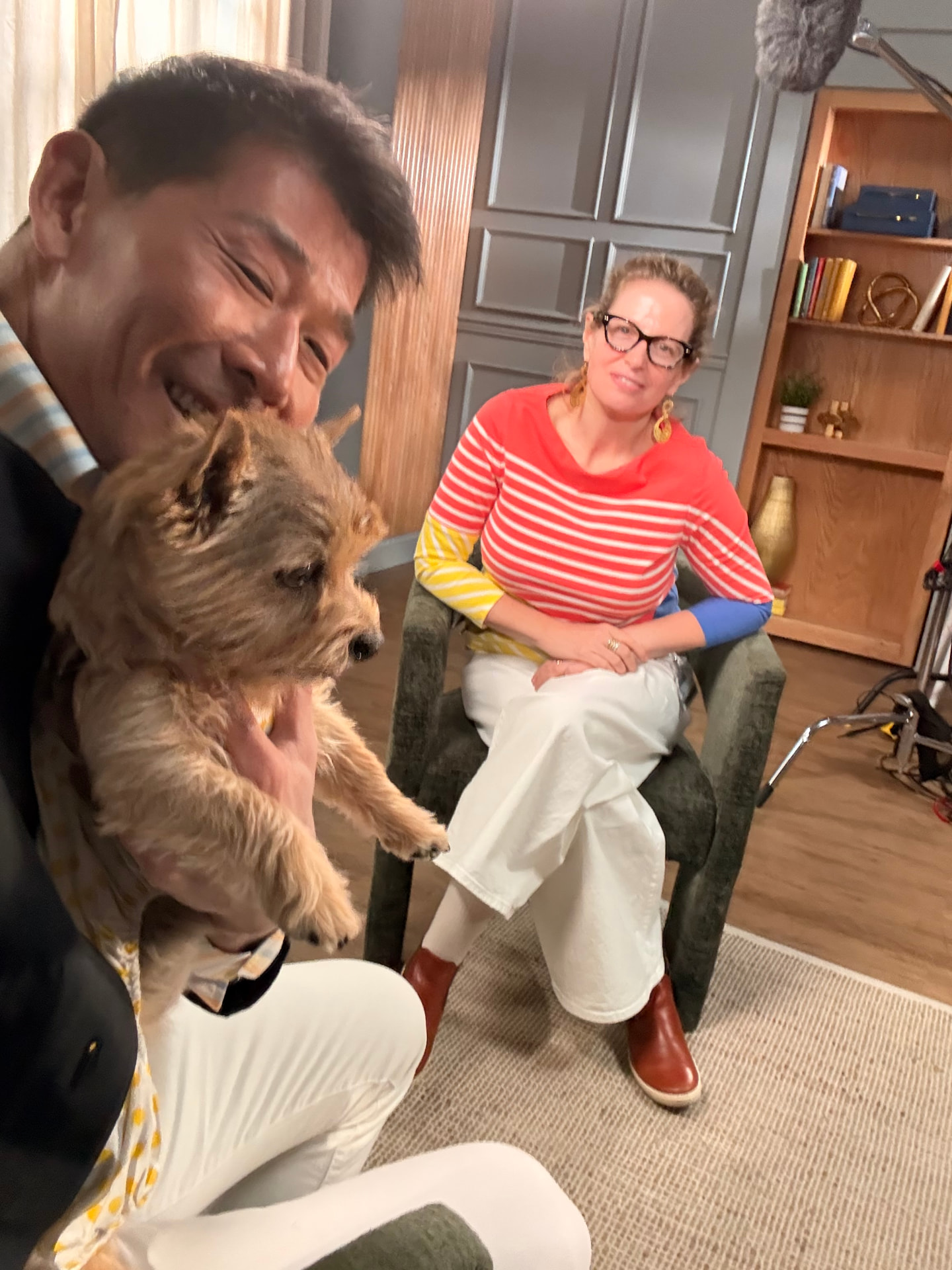 Sam holding Petunia beside the Nightline producer on set at the Manor